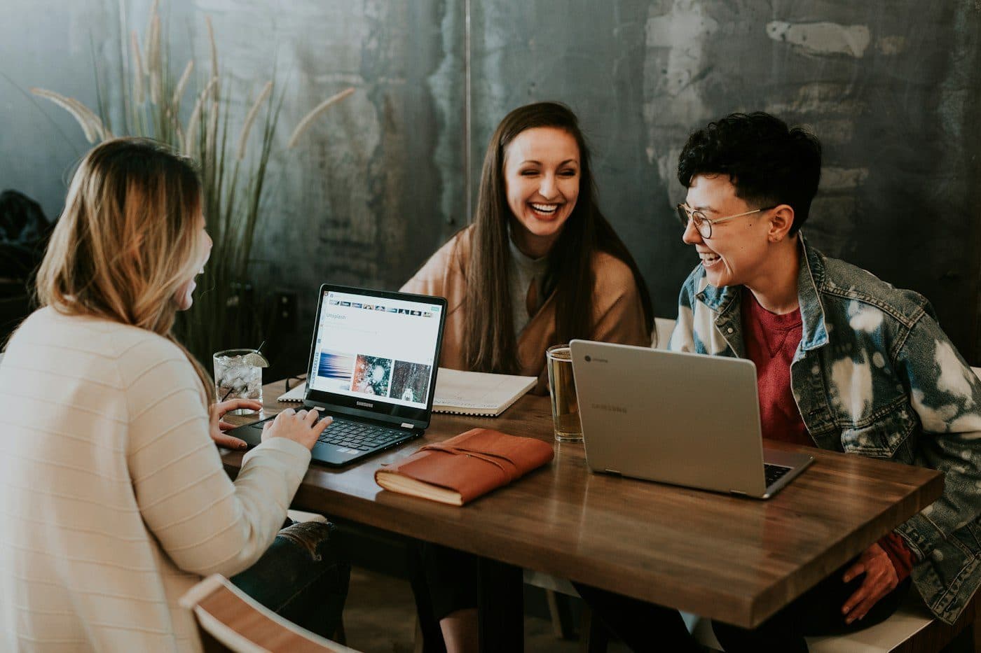 Software developers working remotely on laptops for US companies
